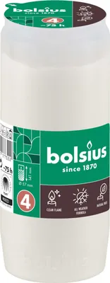 A white candle with a green and brown label.