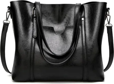A black leather handbag is shown against a white background.