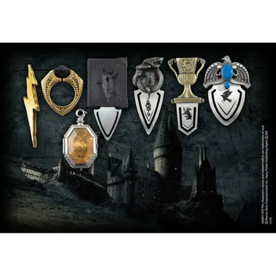 A collection of Harry Potter-themed bookmarks and a ring displayed against a dark, moody background of Hogwarts castle.