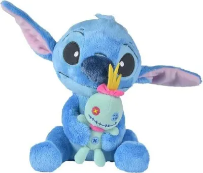 A blue Stitch plush toy is holding a small green Scrump plush toy.