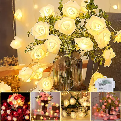 A collage of images showing LED rose string lights in various arrangements and colors, with a main image featuring white roses in a vase.