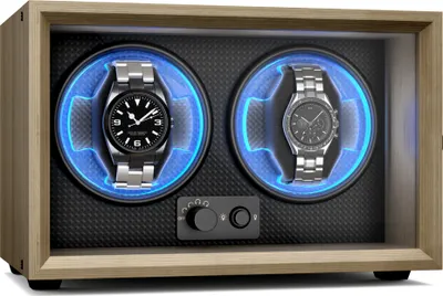 A wooden watch winder with two watches inside, illuminated by blue LED lights.