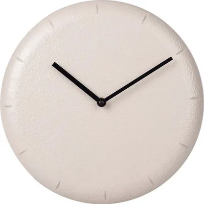 A minimalist wall clock with a textured beige face and black hands.