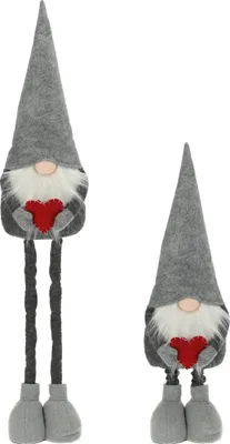 Two decorative gnomes with long legs, each holding a red heart.