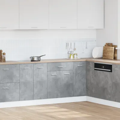A modern kitchen with concrete-effect cabinets and white upper cabinets.
