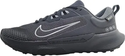 A side view of a black Nike running shoe.