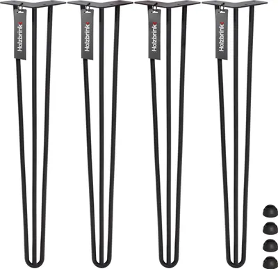 Four black hairpin table legs are displayed standing upright against a white background. Each leg has a small tag attached to the top plate with the brand name 'Holzbrink' printed on it. Four black protective caps are shown in the bottom right corner.