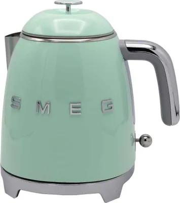 A pastel green Smeg kettle is shown from a front-diagonal angle against a white background.