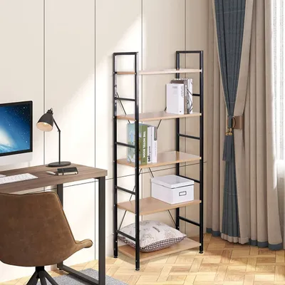 A bookshelf is placed next to a desk with a computer and a chair in a room with curtains.
