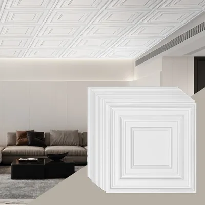 A stack of white ceiling tiles in the foreground, with a living room scene in the background.