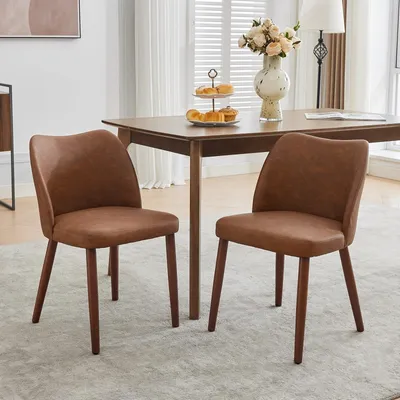 Produktbild von Set aus 2 grünen Esszimmerstühlen mit ergonomischer Rückenlehne und klassischem Design