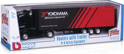 A toy truck and trailer in its retail packaging.