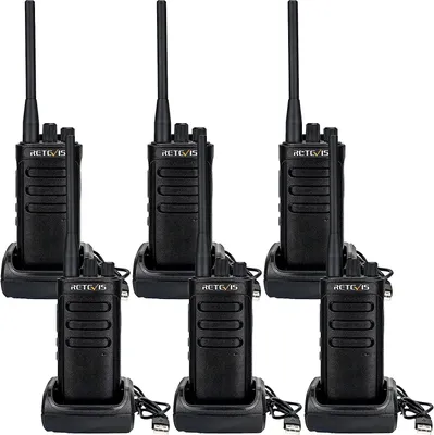 Six black Retevis RB85 professional walkie-talkies are displayed in their charging docks, arranged in two rows of three.