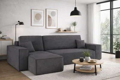 A modern living room with a dark gray sectional sofa.