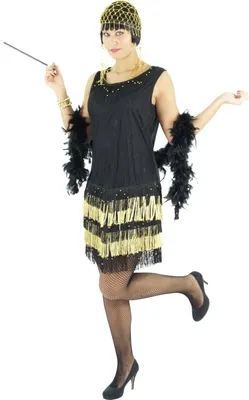 A woman is posing in a 1920s flapper costume.