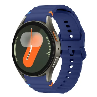 A close-up studio shot of a smart watch with a dark blue strap.
