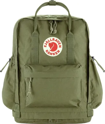 A green Kanken backpack is shown against a white background.