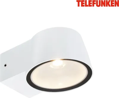 A white outdoor wall lamp with a black rim around the glass cover, illuminated from within.