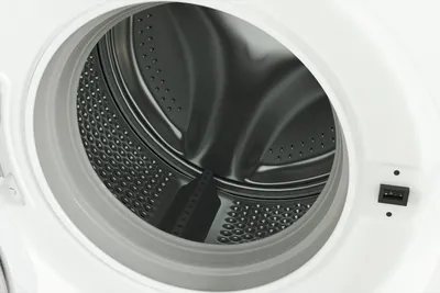 Close-up view of the inside of a washing machine drum.