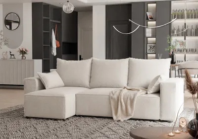 A modern living room with a beige sectional sofa as the focal point.