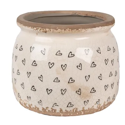 A beige ceramic pot with black heart designs and a distressed rim, shown against a white background.