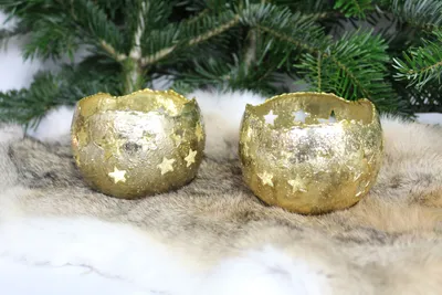 Produktbild von 2 Windlichter Teelichter aus Metall in Goldfarbener Optik mit leuchtenden Sternen