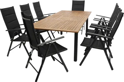 A patio dining set with a wooden table and black chairs, displayed on a white background.