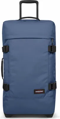 A blue Eastpak suitcase with wheels is shown against a white background.