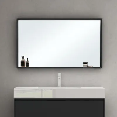 A modern bathroom vanity with a mirror above it, featuring a sink and faucet.