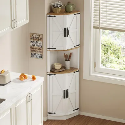 A white corner cabinet with wood accents is shown in a kitchen setting next to a window.