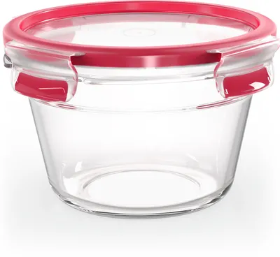 A clear glass food storage container with a red lid and clips, presented on a white background.