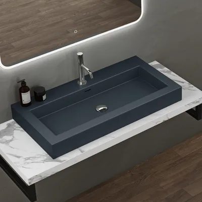 A modern bathroom sink and countertop.
