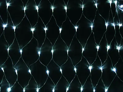 A close-up, full-frame shot of a net of white LED lights against a black background.