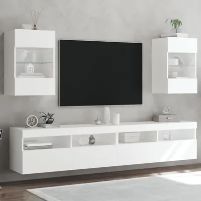A modern living room setup with a TV and wall-mounted cabinets.