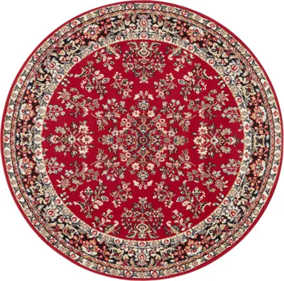 A round rug with a traditional floral pattern.