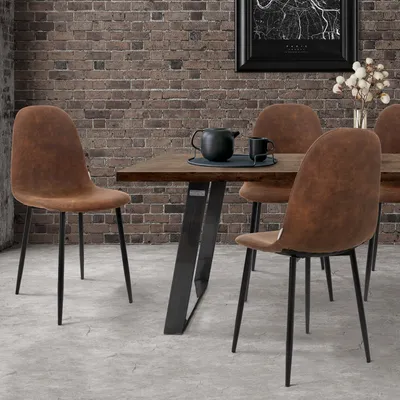 A dining room setting with a table and chairs.