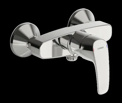 A chrome shower faucet against a black background.