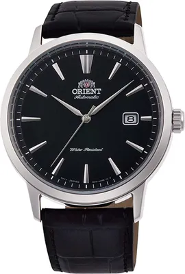 A close-up studio shot of an Orient Bambino automatic watch with a black dial and a black leather strap.