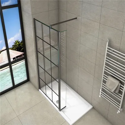 A modern bathroom with a walk-in shower, towel warmer, and a large window overlooking a tropical scene.