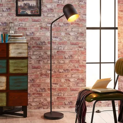 Produktbild von Lindby Industrie / Industrial Coole Stehleuchte / Stehlampe / Standleuchte / Lampe / Leuchte schwarz mit Gold / Messing - Morik / Innenbeleuchtung / Wohnzimmerlampe / Schlafzimmer Stahl Länglich LED geeignet E27 Max. 1 x 60 Watt