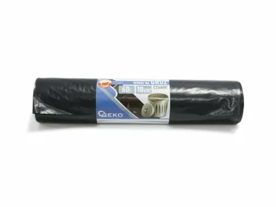 A rolled-up black trash bag with a label on a white background.
