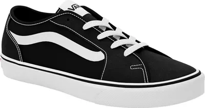 A black and white Vans sneaker shown from the side.