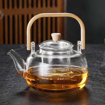 Productafbeelding van Unyqoos® Glazen theepot van 1000 ml, gemaakt van borosilicaatglas, met afneembaar zeefje en deksel – geschikt voor losse thee en theezakjes, hittebestendig en geschikt voor gebruik op inductiekookplaten