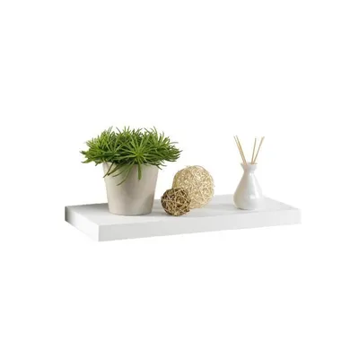 A white shelf with decorative items including a potted plant, two decorative balls, and a diffuser.