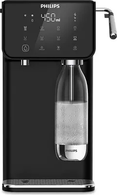 A black Philips sparkling water maker with a bottle of sparkling water inserted.