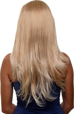 Back view of a person wearing a blue top, with long blonde hair extensions.