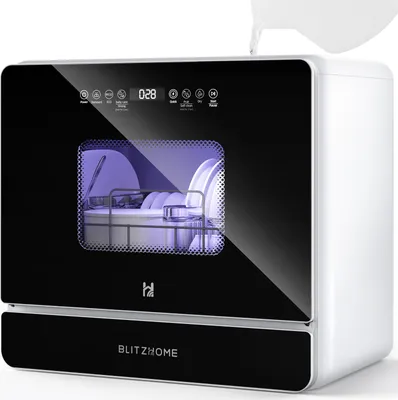 A white and black mini dishwasher with dishes inside, illuminated by purple light. Water is being poured into the top.