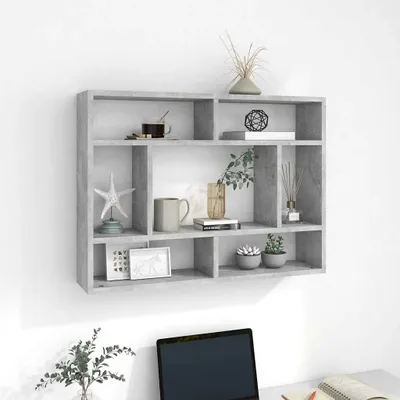 A grey wall-mounted shelf unit filled with decorative items.