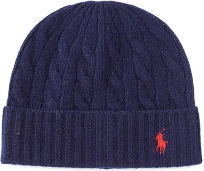 A close-up studio shot of a navy blue beanie with a red logo.