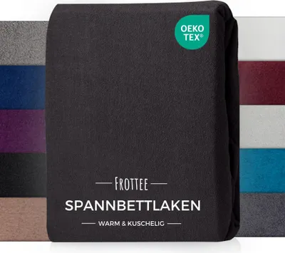 A folded black fitted sheet is displayed with a collage of other colored fitted sheets in the background.